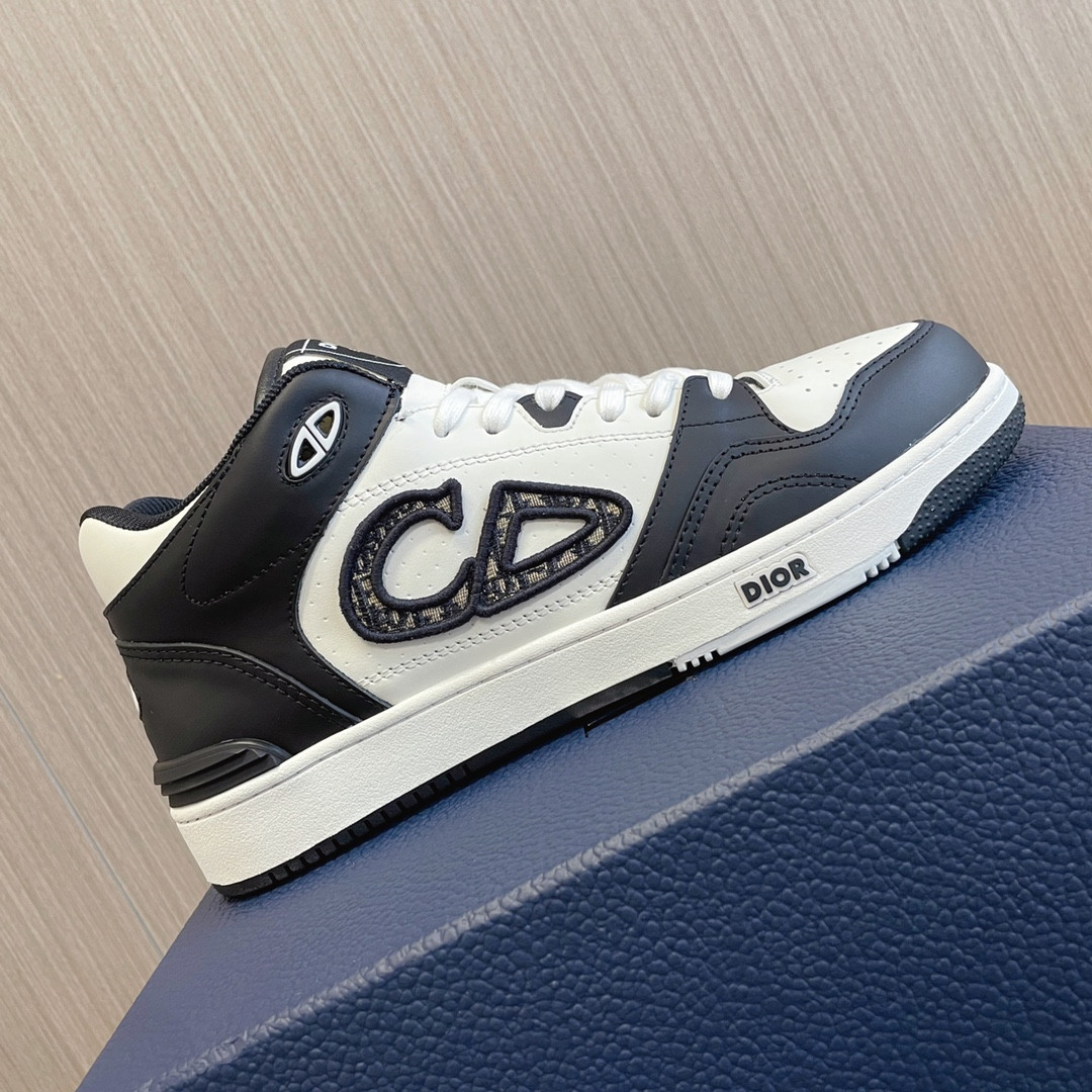 ua D*or b57 mid-top sneaker black and white